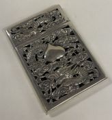 A 19th Century pierced Chinese export silver card case embossed with dragons.
