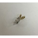 A small diamond single stone pendant.