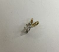 A small diamond single stone pendant.