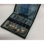 A cased heavy set of six cast silver spoons. Approx. 68 grams