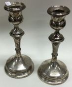 A pair of silver circular candlesticks. Birmingham. Est. £20 - £30.