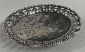 A Chinese export silver pierced salver. Marked to base. Approx. 39 grams.