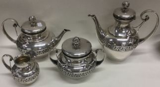 A fine and decorative French silver four piece bachelor tea set. Circa 1900.