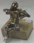A Judaica silver figure of a man playing violin.