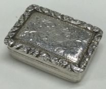 A George III silver vinaigrette with floral engraved decoration. Birmingham 1825.