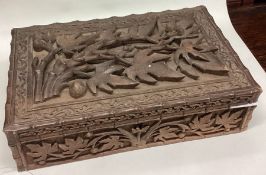 A carved Eastern box together with medals, knives etc.