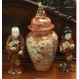 A Japanese vase and cover together with a pair of Oriental figures.