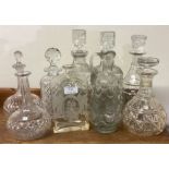 A good collection of cut glass and other decanters.