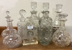 A good collection of cut glass and other decanters.