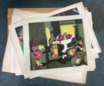A large collection of unframed pictures.