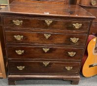 A Georgian oak four drawer chest.
