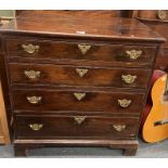 A Georgian oak four drawer chest.