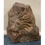 An unusual carved stone statue in the form of a lion.