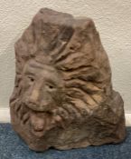 An unusual carved stone statue in the form of a lion.