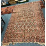 An Antique tapestry rug with floral decoration.