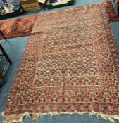 An Antique tapestry rug with floral decoration.