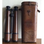 A good pair of leather cased field glasses. By Cloud & Shapland.
