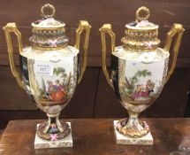 A pair of attractive Continental vases on stands.