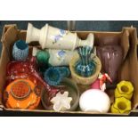 A large collection of coloured glass vases.