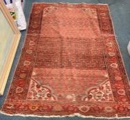 A good red tapestry rug with floral border.