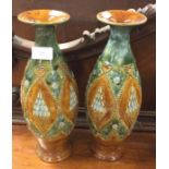 A tall pair of Royal Doulton vases.