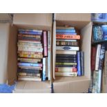 BOOKS: Two boxes of various books including novels.