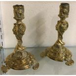 A pair of brass candlesticks.