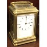 A good brass striking carriage clock with white enamelled dial.