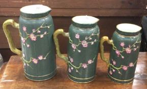A good set of three tapering jugs of aesthetic form.