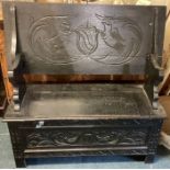 A good carved oak settle.