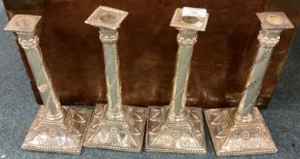 A good set of four silver plated candlesticks.