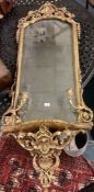 A large gilt framed mirror.