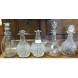 A group of five cut glass and other decanters. Est