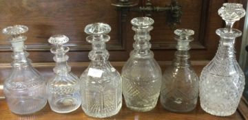 A group of six cut glass decanters. Est. £30 - £40