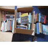 BOOKS: Two boxes of various books including novels.