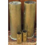Four old brass shell cases.