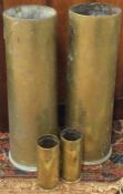 Four old brass shell cases.