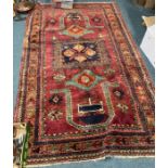 A good red ground tapestry rug with central medallion.