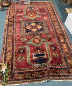 A good red ground tapestry rug with central medallion.