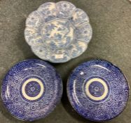 A good pair of Chinese blue and white plates together with one other.