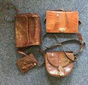 Three leather handbags together with a leather purse.