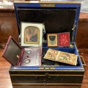A box containing old paper, miniatures etc.