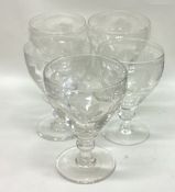 A good set of five etched stem glasses decorated with vines and leaves.