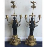 A fine pair of brass candlesticks attractively decorated with swags.