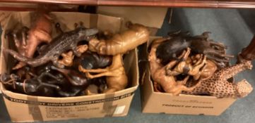 Two boxes of leather animal figures.