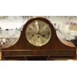 A large mahogany mantle clock.