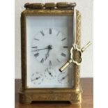 A fine quality French Grand Sonnerie carriage clock with engraved case to white multi dial.