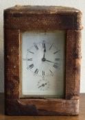 A heavy French brass carriage clock in leather travelling case.