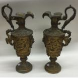 A pair of heavy decorative vase shaped gilded cand