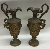 A pair of heavy decorative vase shaped gilded cand